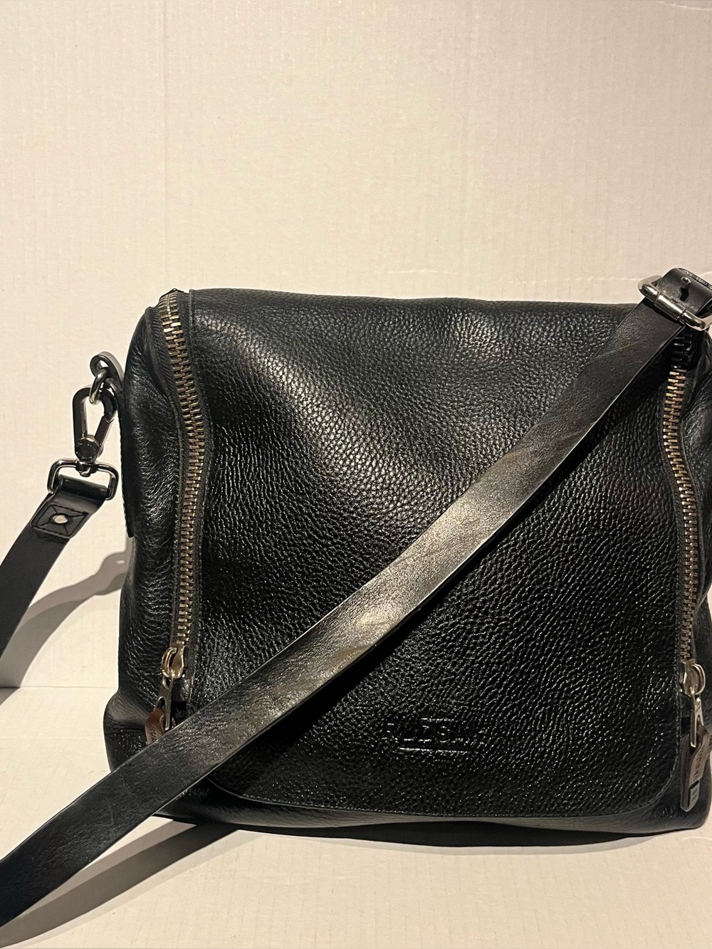 Rudsak black pebbled leather crossbody shoulder bag.
